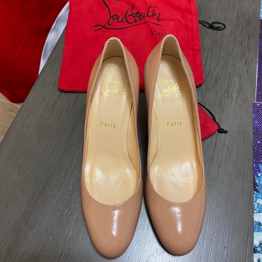 Used twice louboutin red bottom nude pumps